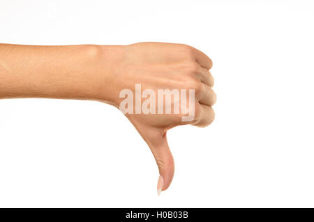 Main de femme Vue de côté montrant Thumbs down against white background Banque D'Images