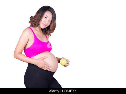 Belle femme enceinte avec apple vert isolé sur fond blanc Banque D'Images