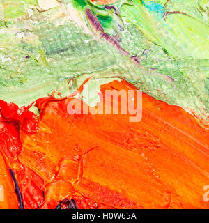 Orange et vert de la peinture à l'huile pinceau sur toile close up Banque D'Images