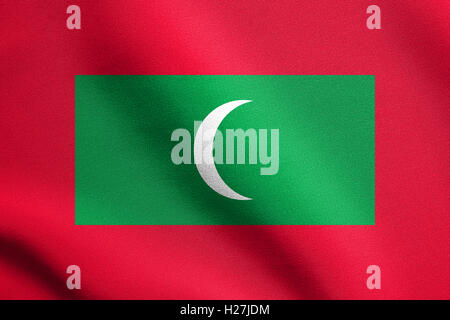 Symbole national des Maldives. La conception de fond patriotique. Brandissant des Maldives drapeau dans le vent avec texture tissu détaillées Banque D'Images