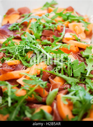 Avec salade de roquette fraîche et cantaloup Banque D'Images