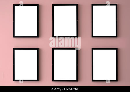 Six cadres photo vierge accrocher au mur avec la couleur pantone 2016 de quartz rose. Banque D'Images