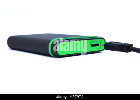 Disque dur externe vert et le câble noir Banque D'Images