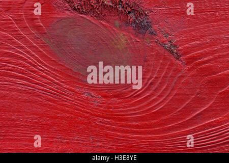 Une texture rouge vif en bois gros plan l'arrière-plan Banque D'Images