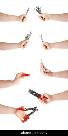 Ensemble de main tenant les outils de travail, la composition de l'isolé sur fond blanc Banque D'Images
