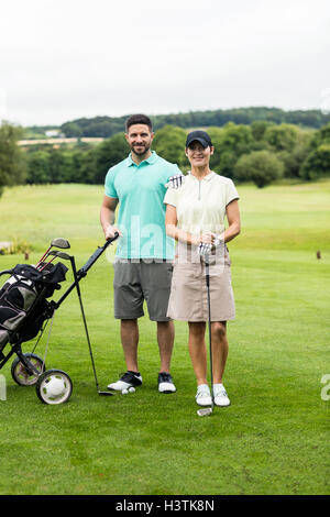 Couple golf club et golf en sac Banque D'Images