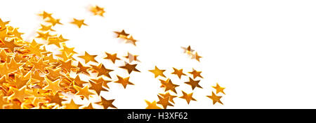 Maison de vacances petites étoiles brillant d'or tableau des ornements sur fond blanc, en-tête de vacances Banque D'Images