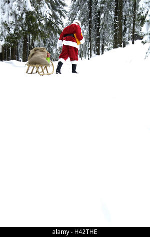 Forêt d'hiver, le Père Noël, traîneau, Sack, cadeaux, vue de dos, Banque D'Images