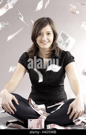 Adolescentes, les jambes croisées, windfall, Banque D'Images