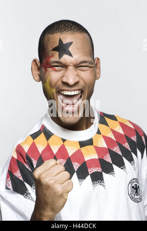 Fan de football, Manly, la peau sombre, la joie, le geste, la moitié, portrait, beauté, parution du modèle studio, personne, homme, football, championnat du monde, championnat du monde, la nationalité, le Sud, l'Afrique, l'homme, nigériane, cut out, l'Allemagne, l'Bemahlung, ventilateur, football jersey, st Banque D'Images