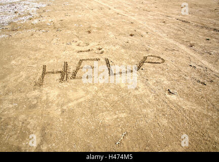 Aider écrit dans le sable à Agnos, Corfu Grèce Banque D'Images