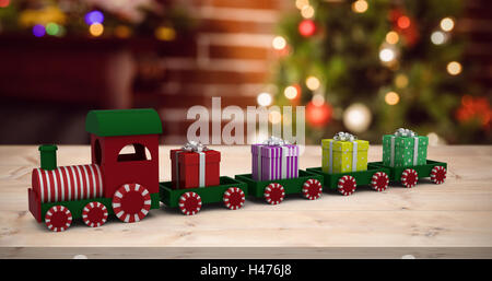 Image composite du modèle de train transportant des boîtes cadeaux Banque D'Images
