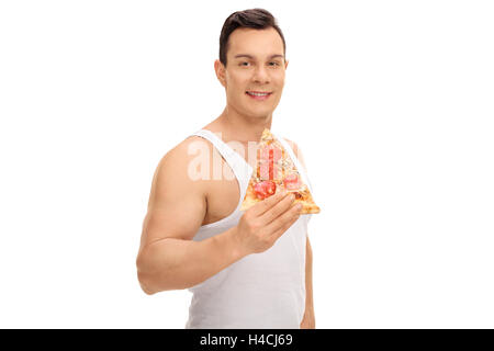 Jeune homme ayant une pizza slice isolé sur fond blanc Banque D'Images