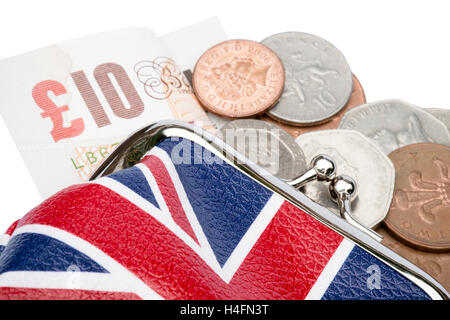 Sac à main avec des pièces d'argent & £10 pound note tomber. Union Jack design. Banque D'Images
