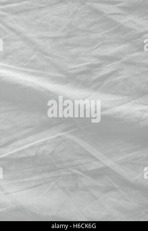 Draps de lit utilisé la texture, nettoyer la surface du matériau en coton froissé blanc Banque D'Images