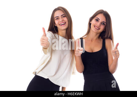 Deux jeunes woman showing Thumbs up Banque D'Images