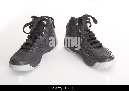 Children's modern high-top noir cuir et maille chaussures de basket-ball, sneakers isolated on white Banque D'Images