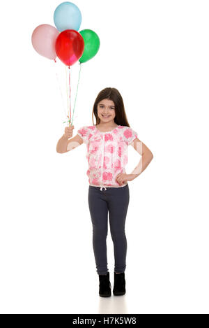 Little girl holding balloons Banque D'Images