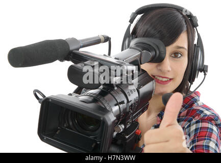 Jolie jeune fille brune avec un caméscope professionnel, isolé sur fond blanc Banque D'Images