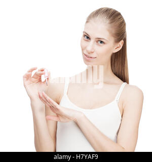 Jeune blond woman holding nail polish Banque D'Images