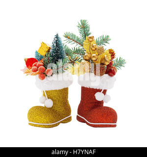 Bottes rouges et or du Père Noël avec des décorations de Noël isolé Banque D'Images