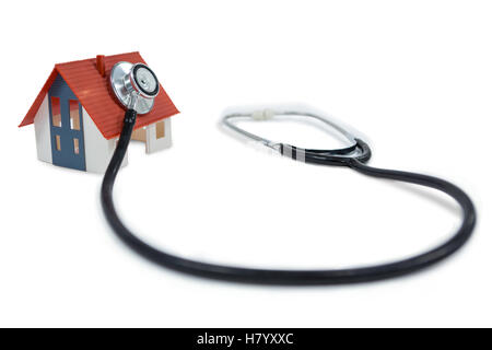 Toy house with stethoscope Banque D'Images