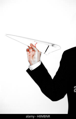 Businessman Throwing Paper Airplane Banque D'Images