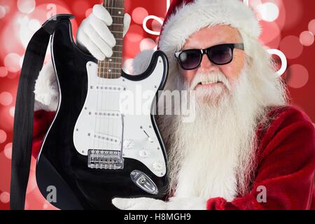 Père Noël en lunettes holding guitar Banque D'Images