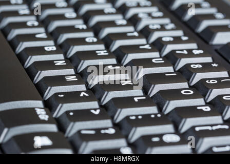 Clavier ordinateur noir avec lettres blanches. Banque D'Images