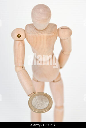 Jointed doll avec euro coin Banque D'Images