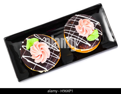 Gâteaux biscuits colorés avec du glaçage de bush et sa crème anglaise le remplissage. Studio Photo Banque D'Images