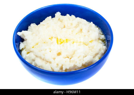 Riz au lait dans un bol bleu. Studio Photo Banque D'Images