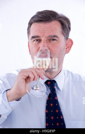 Businessman drinking Sparkling wine Banque D'Images