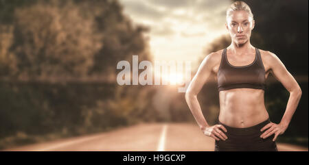 Image composite de l'athlète féminine de l'article with hand on hip Banque D'Images