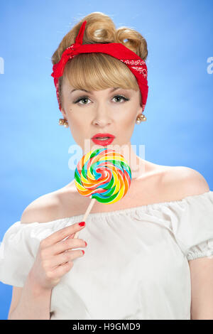 Pin up girl with lollipop candy Banque D'Images