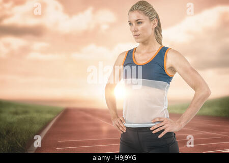 Image composite de l'athlète féminine de l'article with hand on hip Banque D'Images