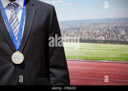 Composite image of businessman poitrine avec medal Banque D'Images