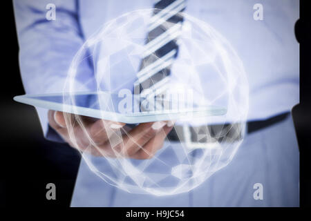 Composite image view of businessman using tablet computer Banque D'Images