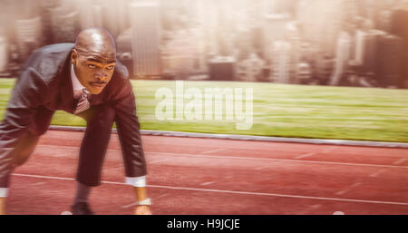 Composite image of businessman in starting blocks Banque D'Images