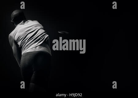 Libre de athletic man throwing discus Banque D'Images