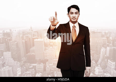 Image composite de stern asian businessman Banque D'Images