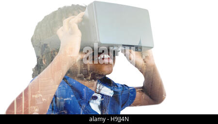 Image composite de boy wearing simulateur de réalité virtuelle Banque D'Images