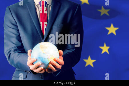 Composite image of businessman holding globe terrestre Banque D'Images