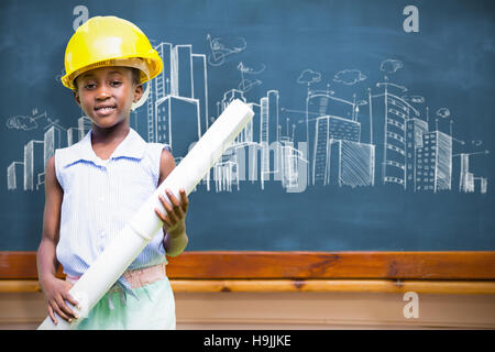 Image composite de little girl wearing casque jaune et plan de construction Banque D'Images