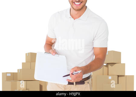Composite image of delivery man holding clipboard Banque D'Images