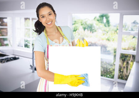 Composite image of woman wiping surface blanche vers le bas Banque D'Images