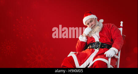 Image composite de santa claus relaxing on chair Banque D'Images