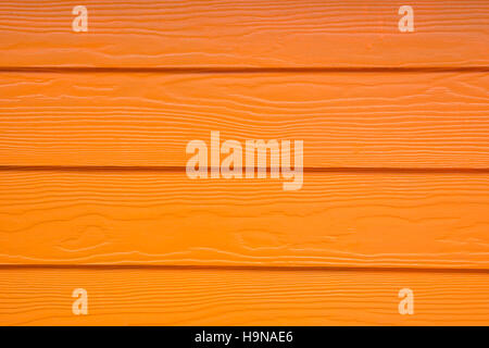 Les conseils en bois coloré peint en orange. Fond en bois Banque D'Images