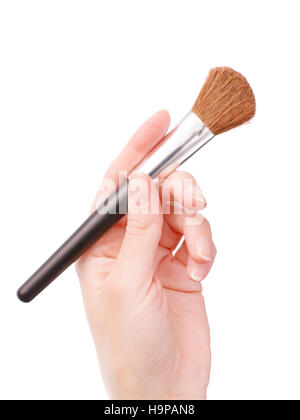 Woman hand holding cosmetic brush. Isolated on white Banque D'Images