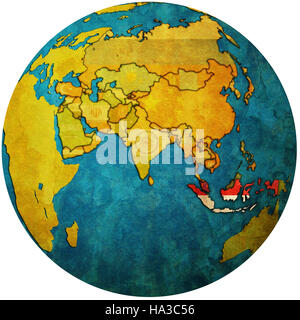 Isolated over white territoire de l'Indonésie avec le drapeau sur la carte globe Banque D'Images